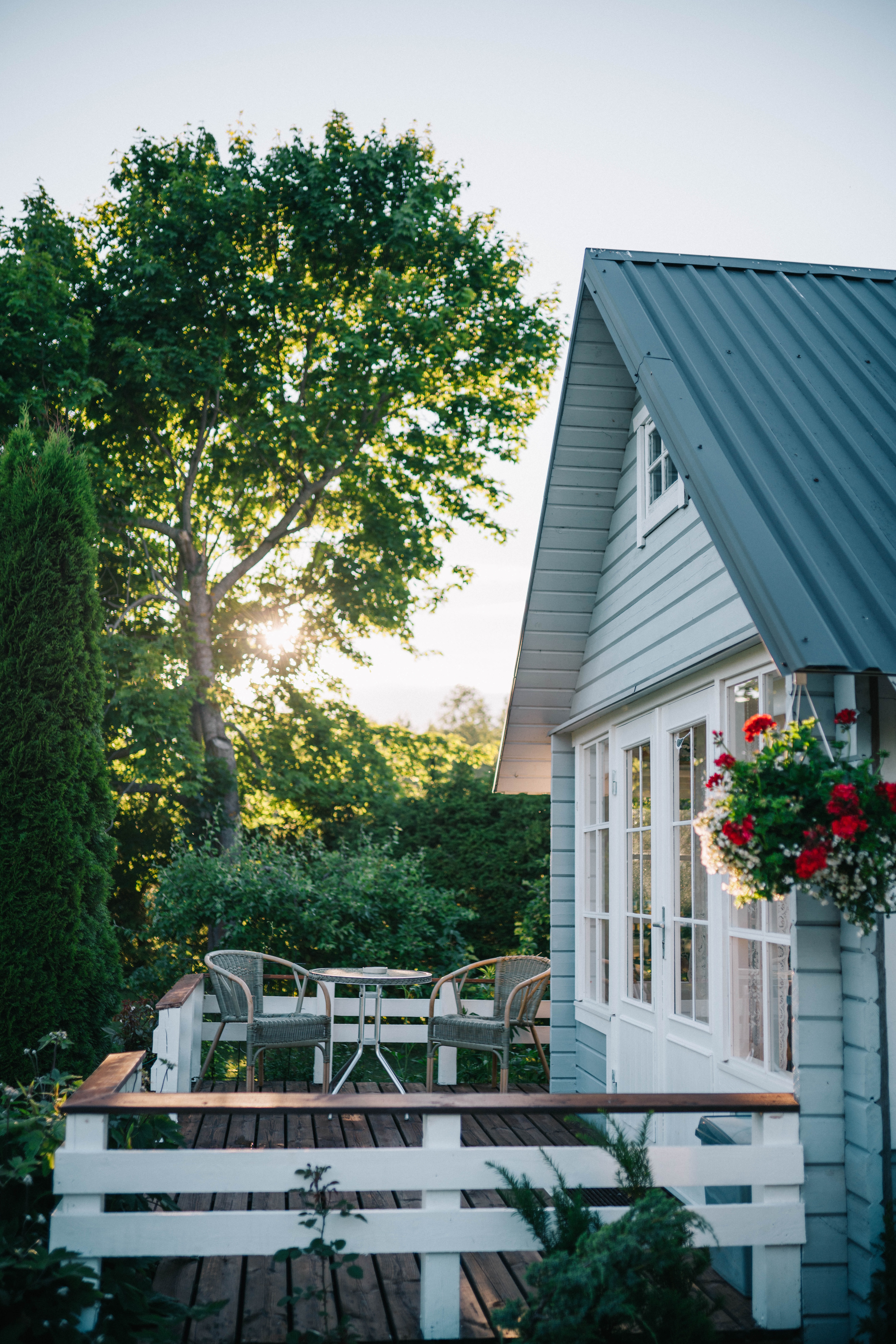 A cottage-style home porch at dusk, highlighting what a mortgage amortization is